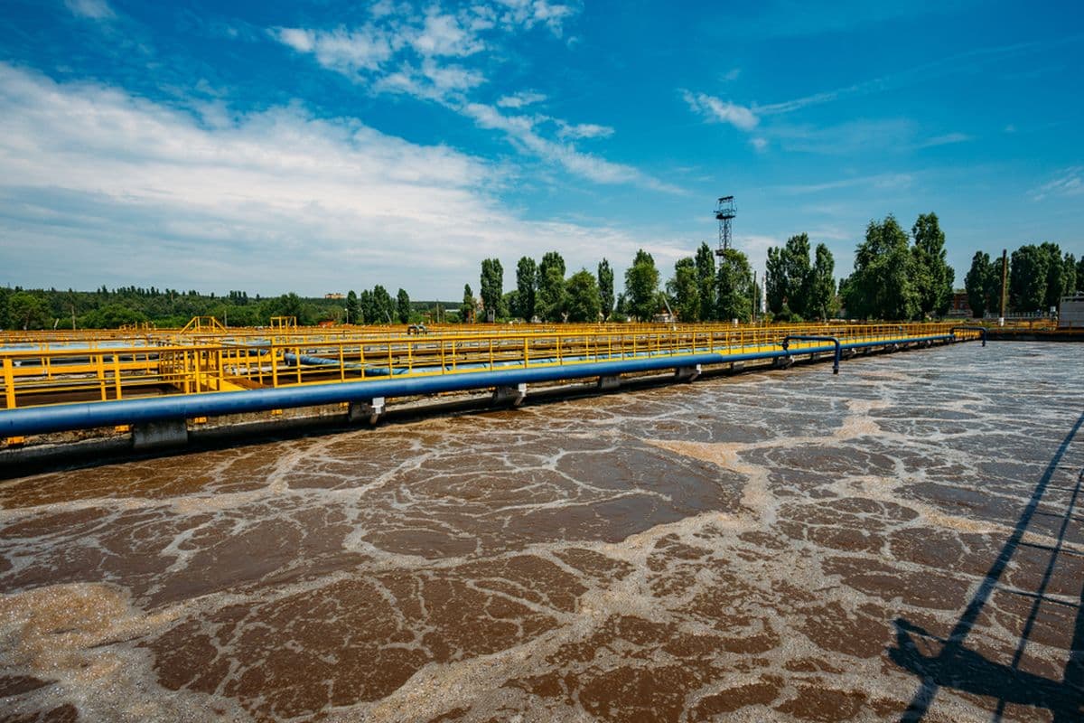 Aeration basin with surface turbulence from diffused air.